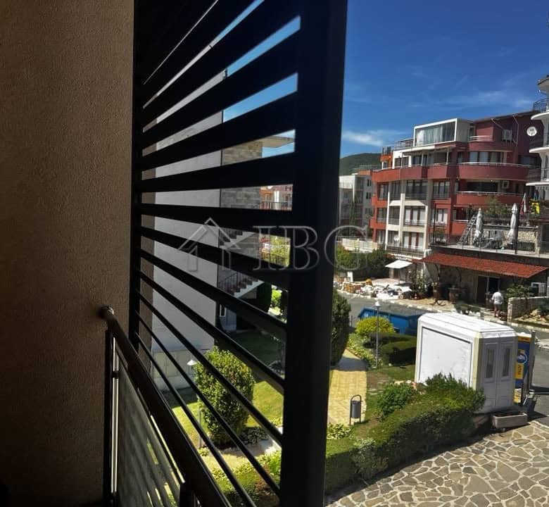 View from balcony of a 2-bedroom apartment in Sveti Vlas with sea and cityscape background.