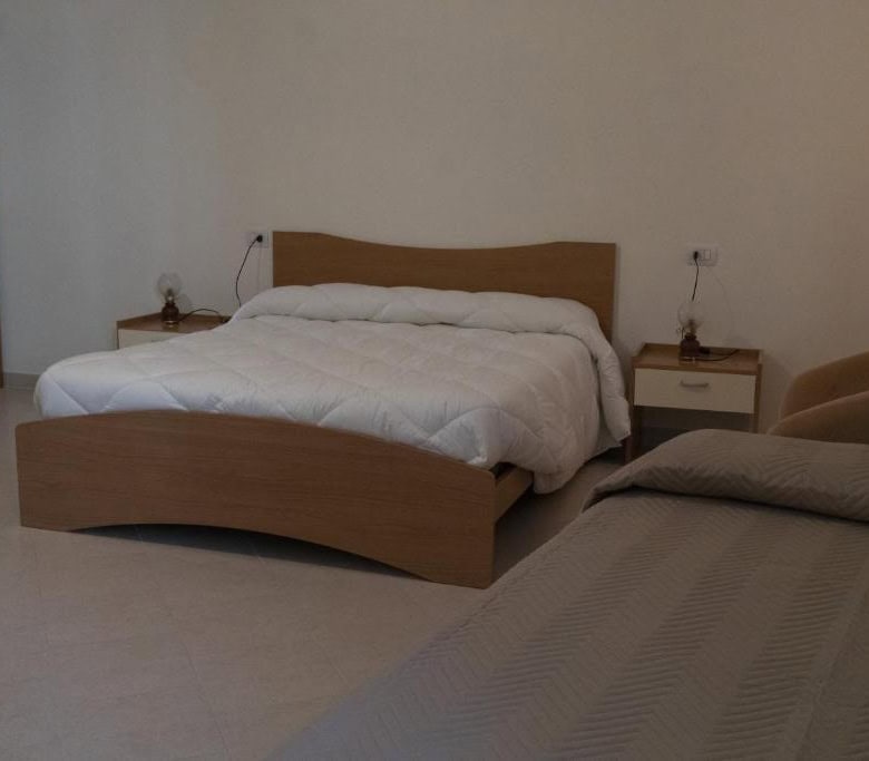 Spacious bedroom in a beautiful 5-bedroom house for sale in Sepino, Italy, offering comfort and scen.