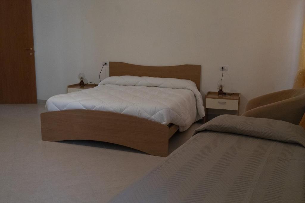 Spacious bedroom in a beautiful 5-bedroom house for sale in Sepino, Italy, offering comfort and scen.