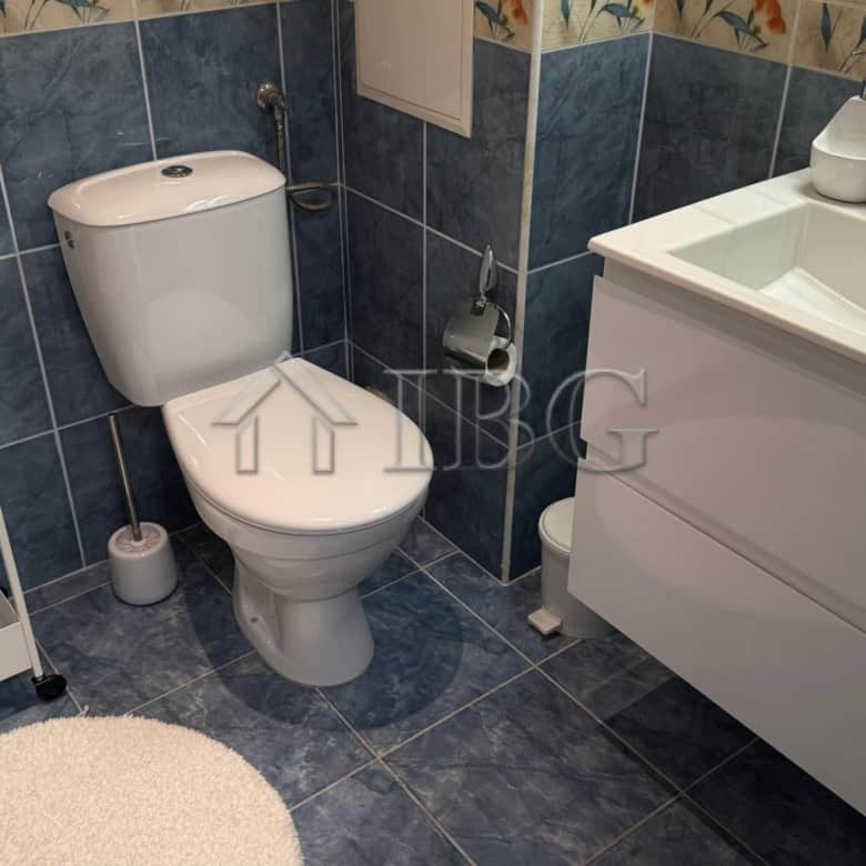 Bright bathroom with modern fixtures in Pomorie Beach Resort apartment.