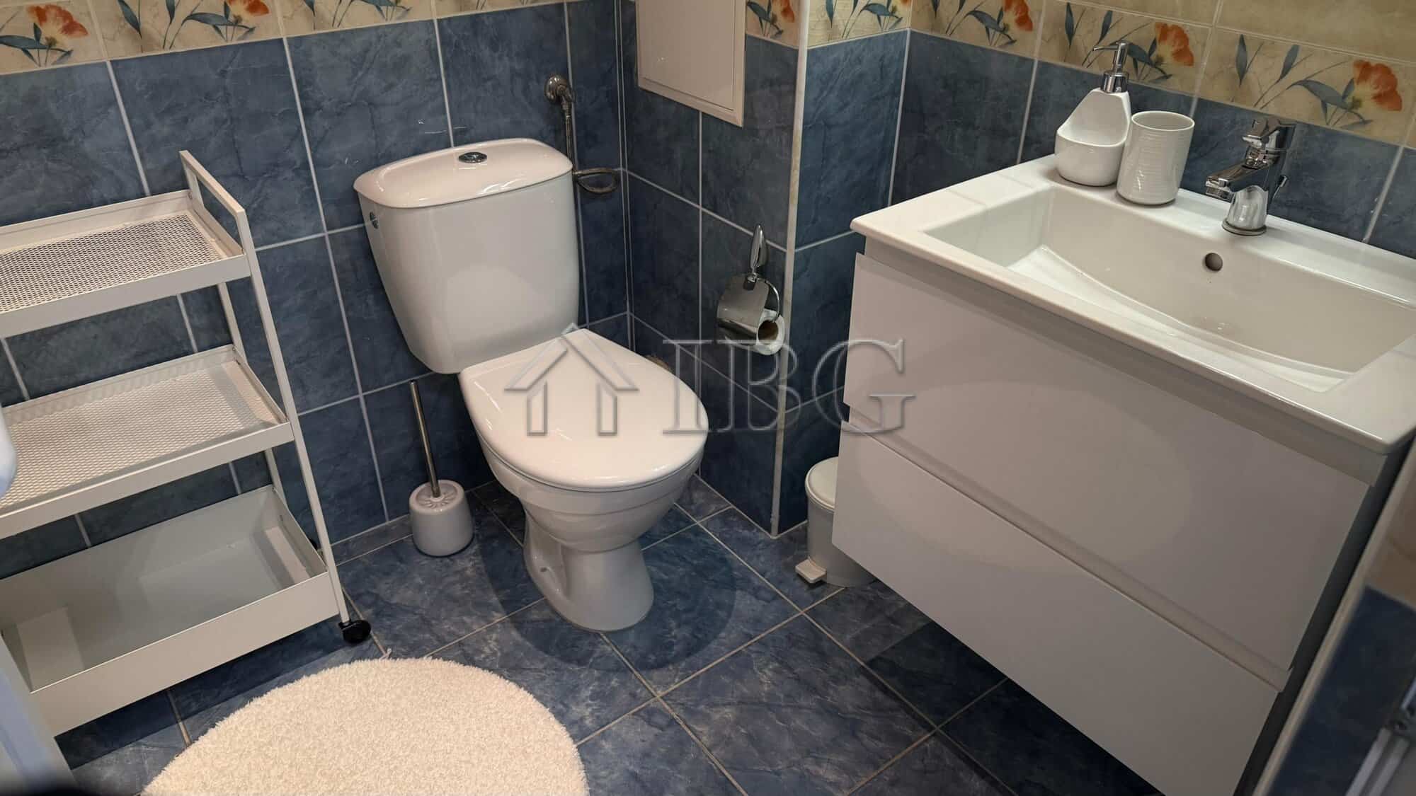 Bright bathroom with modern fixtures in Pomorie Beach Resort apartment.