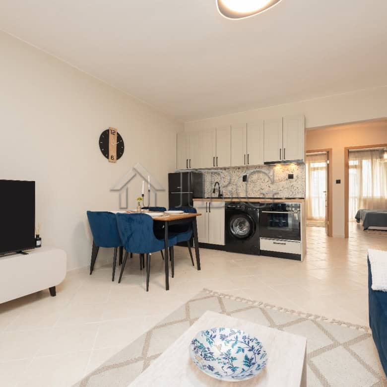 Modern 2-bedroom apartment with pool view in Sunny Beach, featuring a fully equipped kitchen and sty.