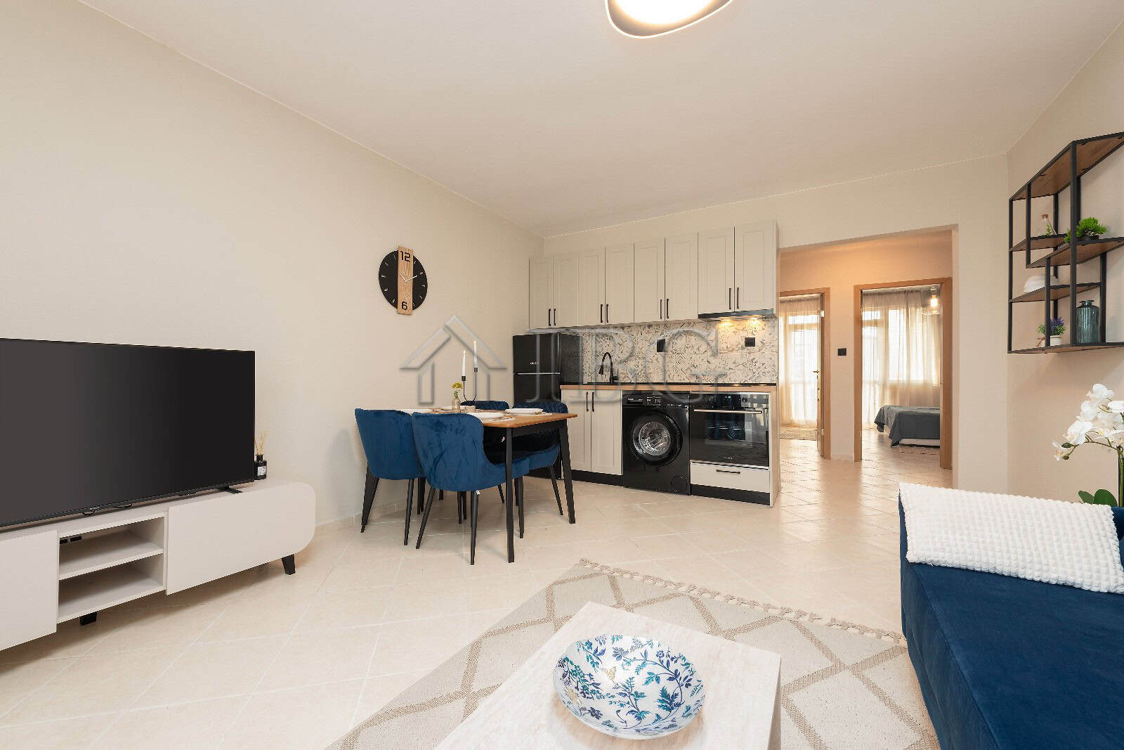 Modern 2-bedroom apartment with pool view in Sunny Beach, featuring a fully equipped kitchen and sty.