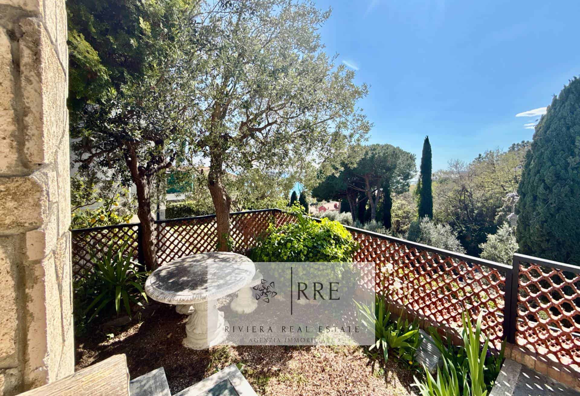 Mediterranean garden with lush greenery, trees, and scenic views from the balcony.
