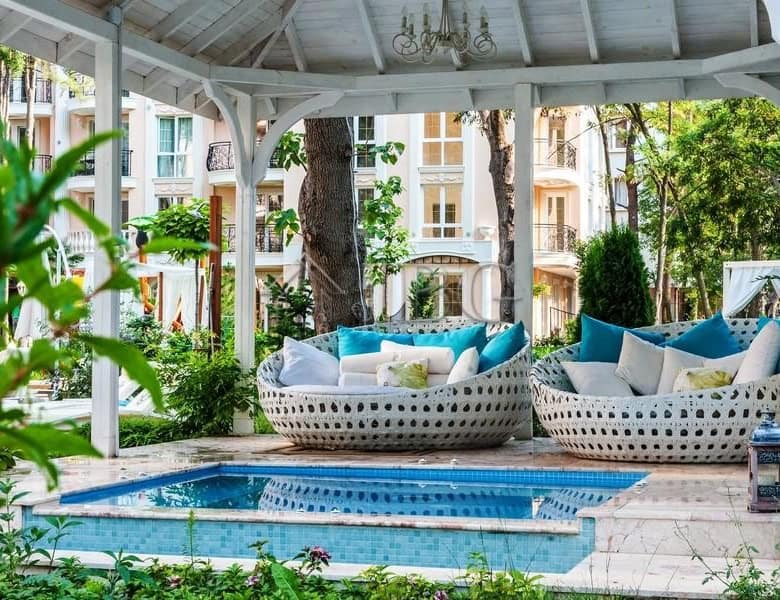 Elegant outdoor lounge with pool at Venera Palace, Sunny Beach. Perfect for relaxing and enjoying su.