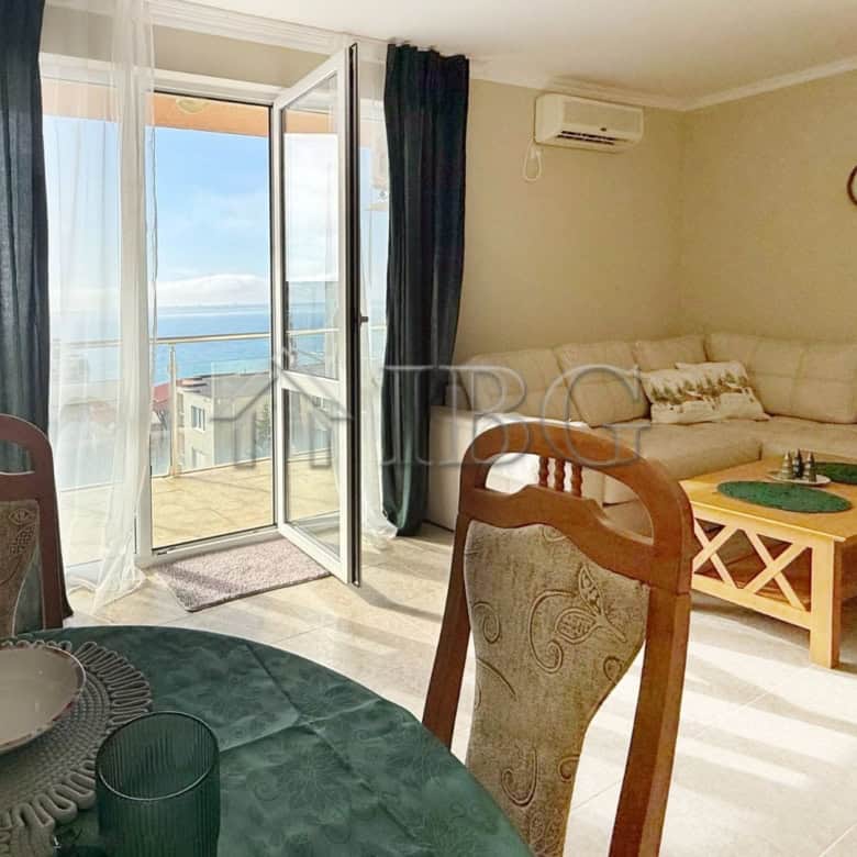 Bright living room with balcony overlooking the sea in Sveti Vlas.