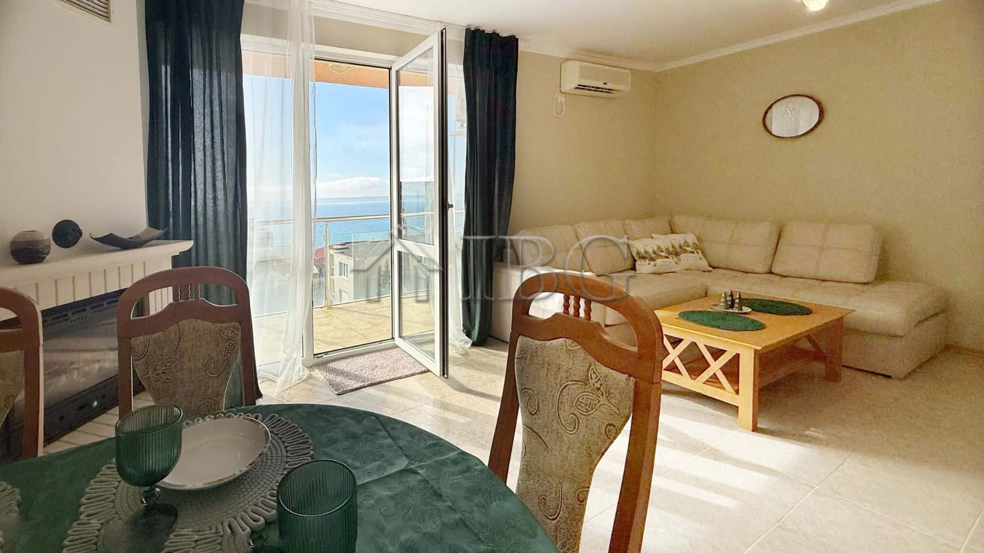 Bright living room with balcony overlooking the sea in Sveti Vlas.