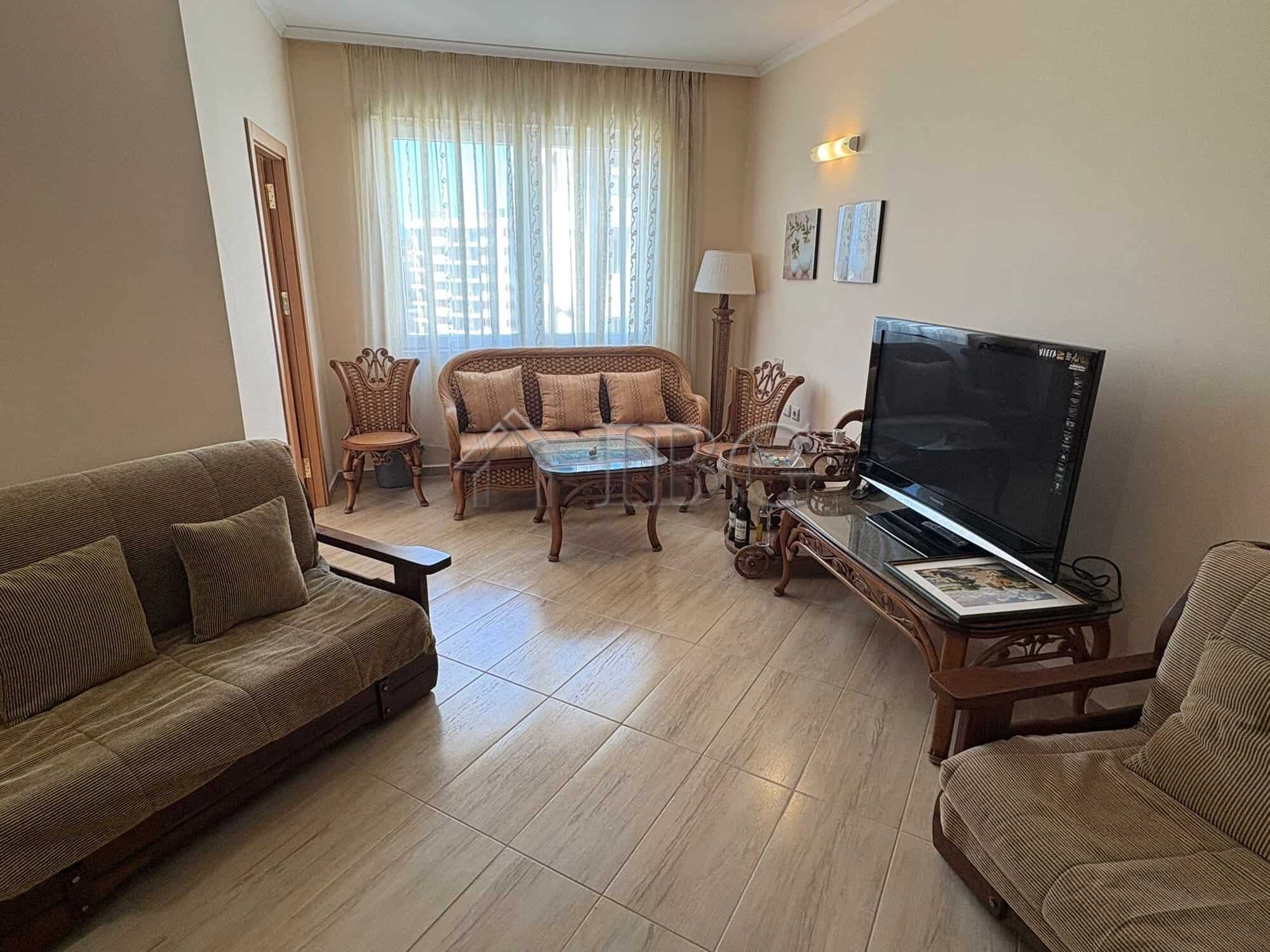 Bright living room with comfortable seating and modern amenities.