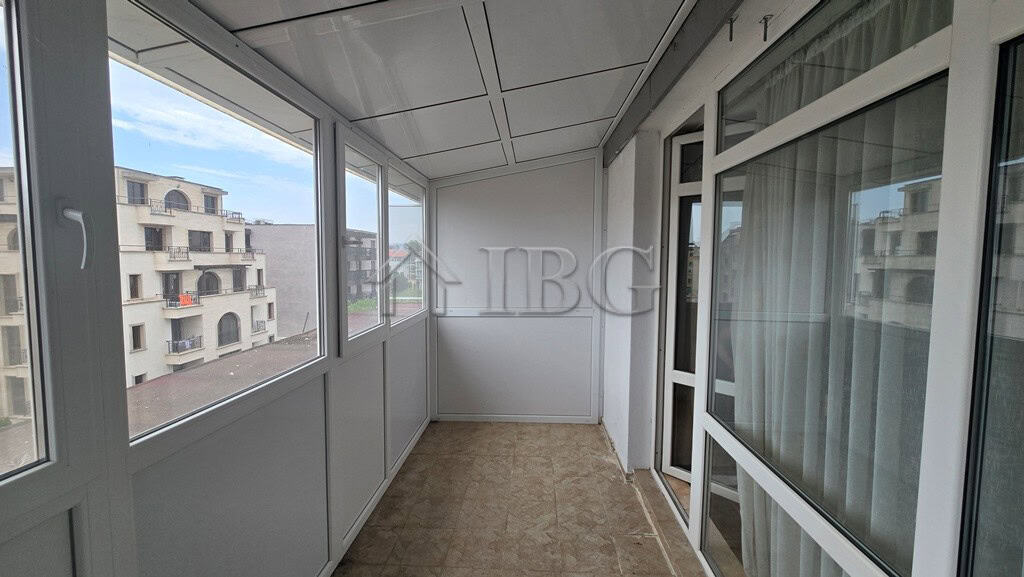 Bright balcony with views of Sunny Beach buildings and clear skies.