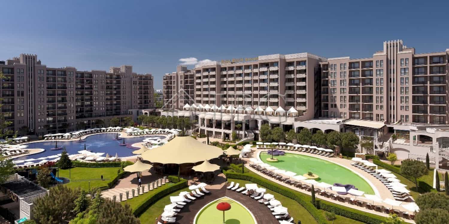 Pool area with sun loungers and umbrellas at Barceló Royal Beach, Sunny Beach.
