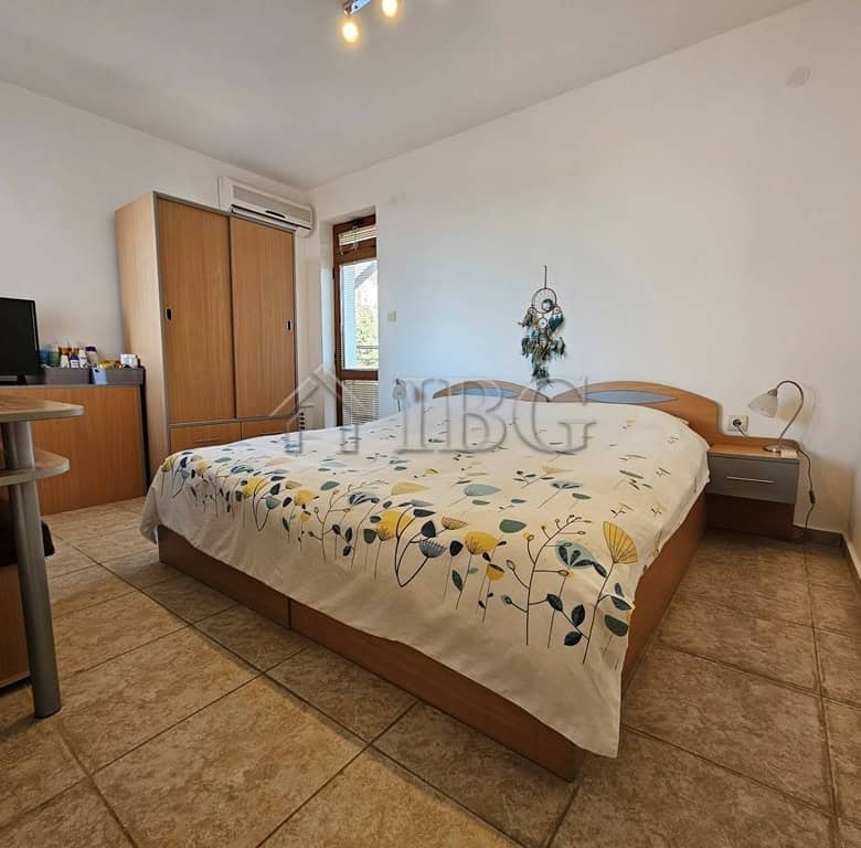 Bright bedroom with a double bed and modern decor in Sveti Vlas, Dinevi Resort.