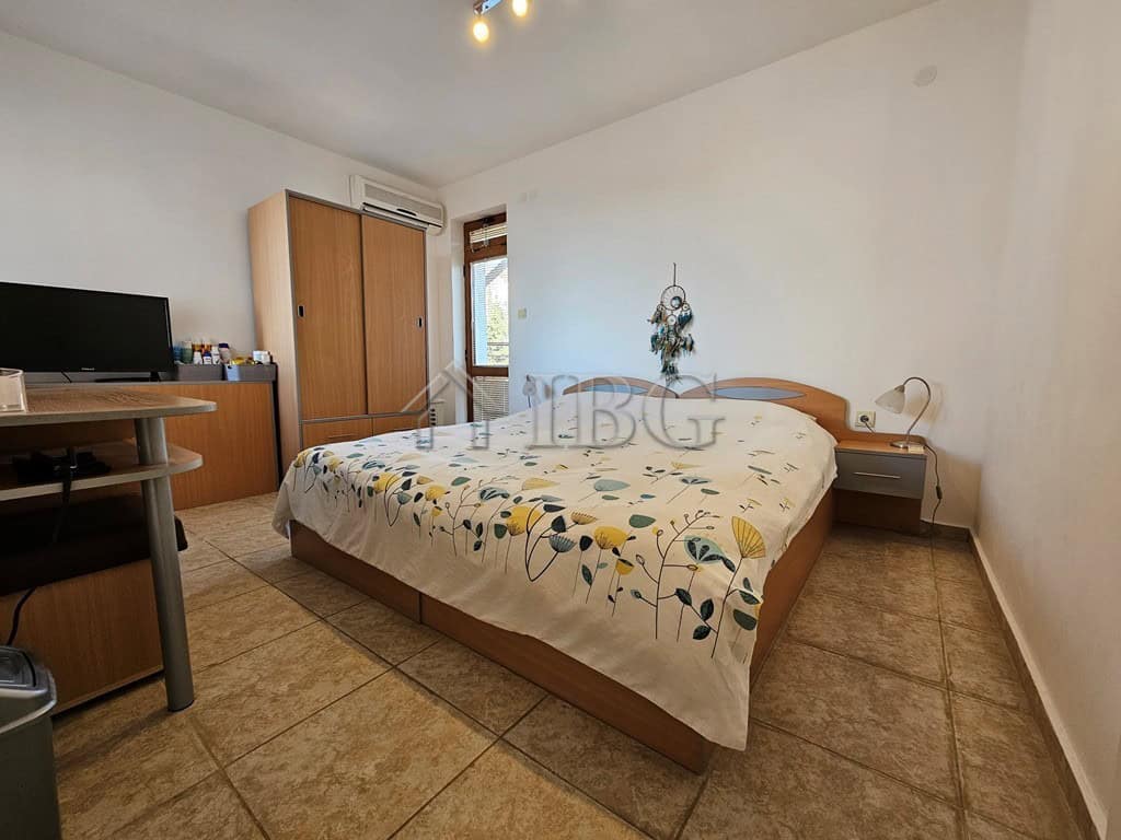 Bright bedroom with a double bed and modern decor in Sveti Vlas, Dinevi Resort.