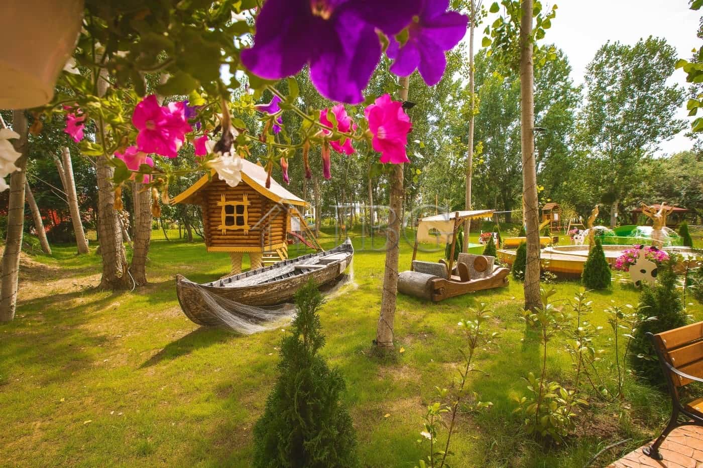 Charming outdoor scene with lush greenery, colorful flowers, and playful wooden boat and golf cart i.