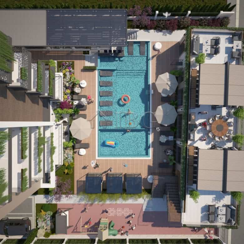 Bright, spacious pool area with sun loungers and umbrellas for relaxation.