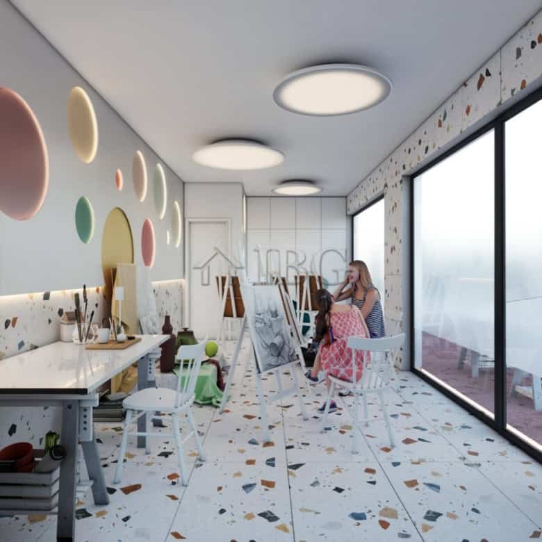 Bright, colorful living space with artistic wall decor and large windows offering scenic views.