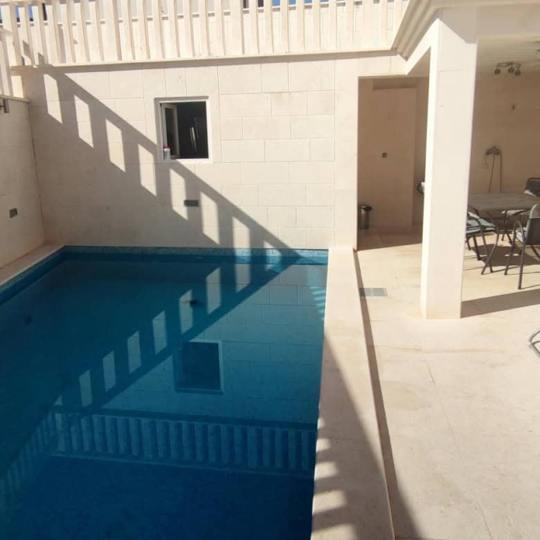 Cozy apartment with private pool and outdoor seating in Okrug Donji Croatia.