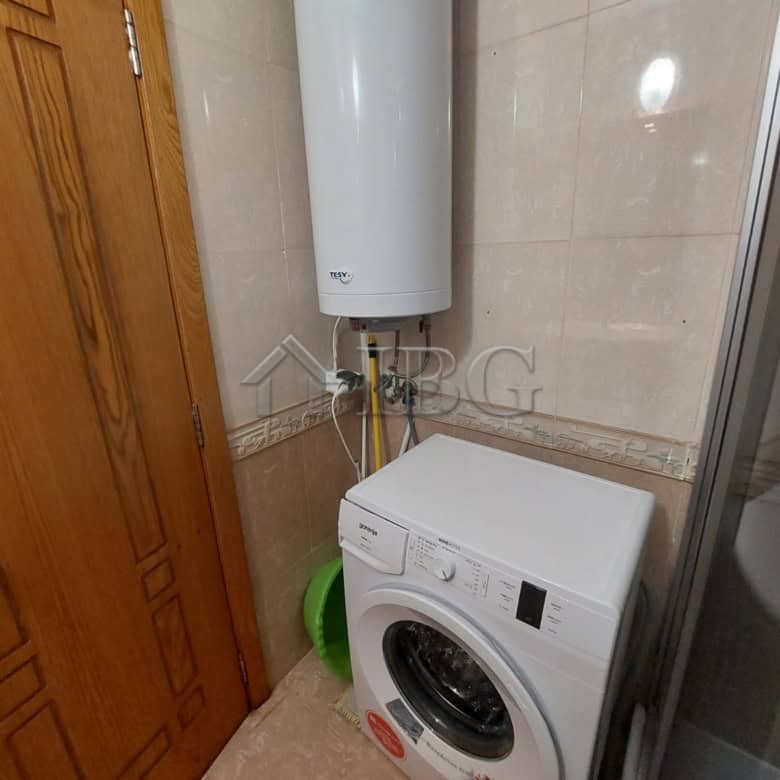 Laundry area with washing machine in Sea Grace Complex, Sunny Beach.