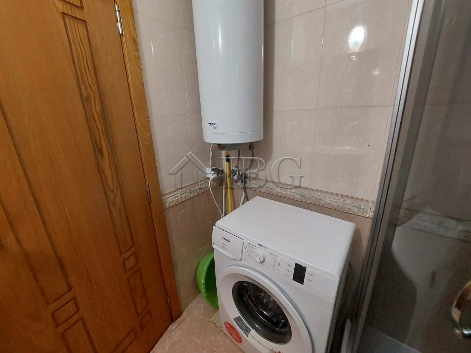 Laundry area with washing machine in Sea Grace Complex, Sunny Beach.