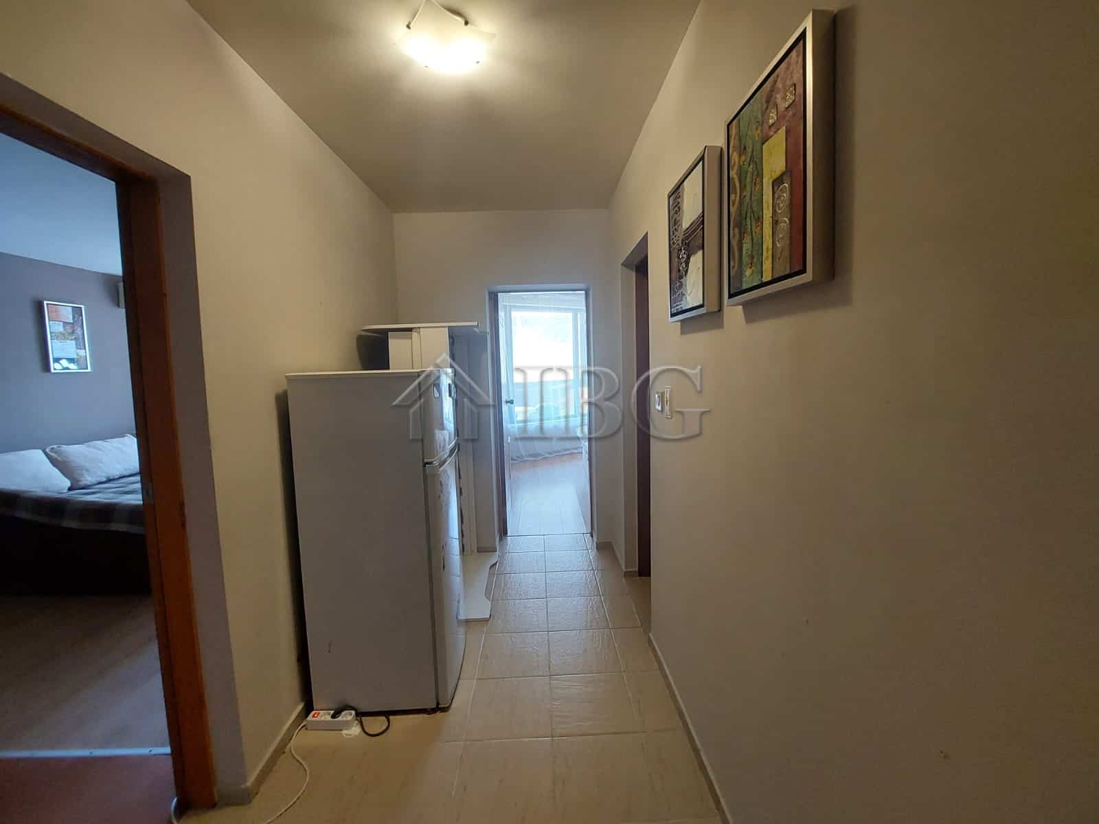 Apartment interior with refrigerator and hallway in Sea Grace Complex, Sunny Beach.