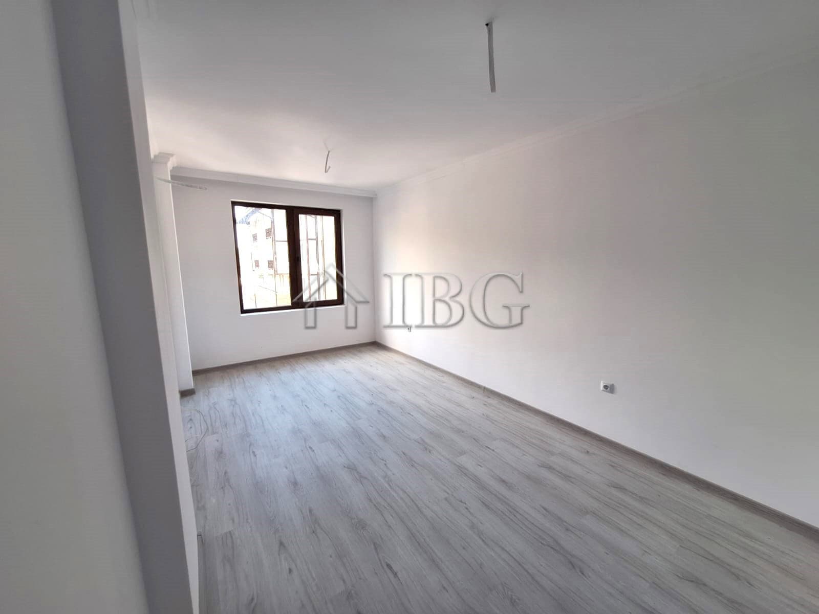 Spacious interior of a 2-bedroom apartment in Etara 4, Sveti Vlas, featuring forest and partial sea.
