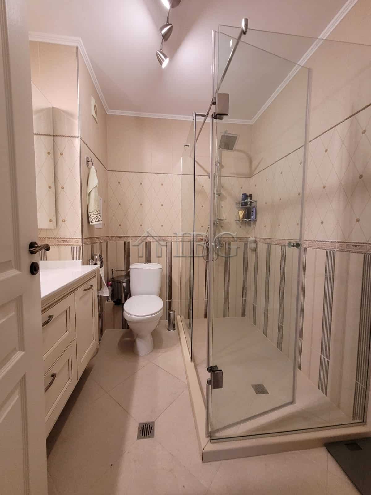 Elegant bathroom in a three-level maisonette featuring a modern shower enclosure and sea view.