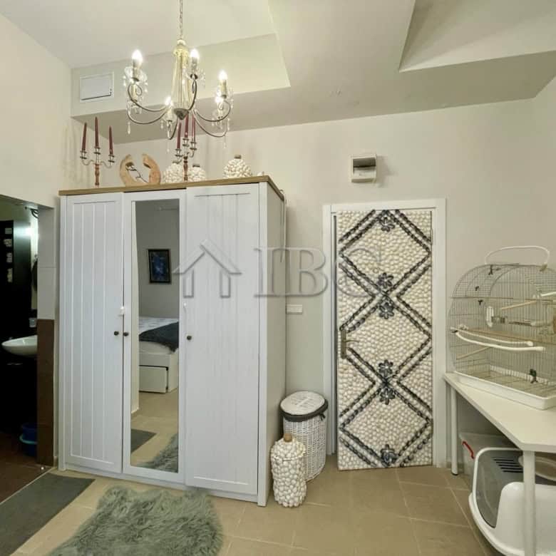 Bright bedroom featuring a large wardrobe and decorative elements in Sun Gate, Sunny Beach.