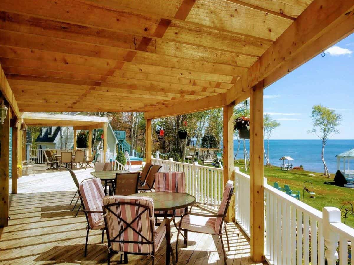 Ocean view porch at Sea Parrot Ocean View Manor in Englishtown, Nova Scotia, Canada.