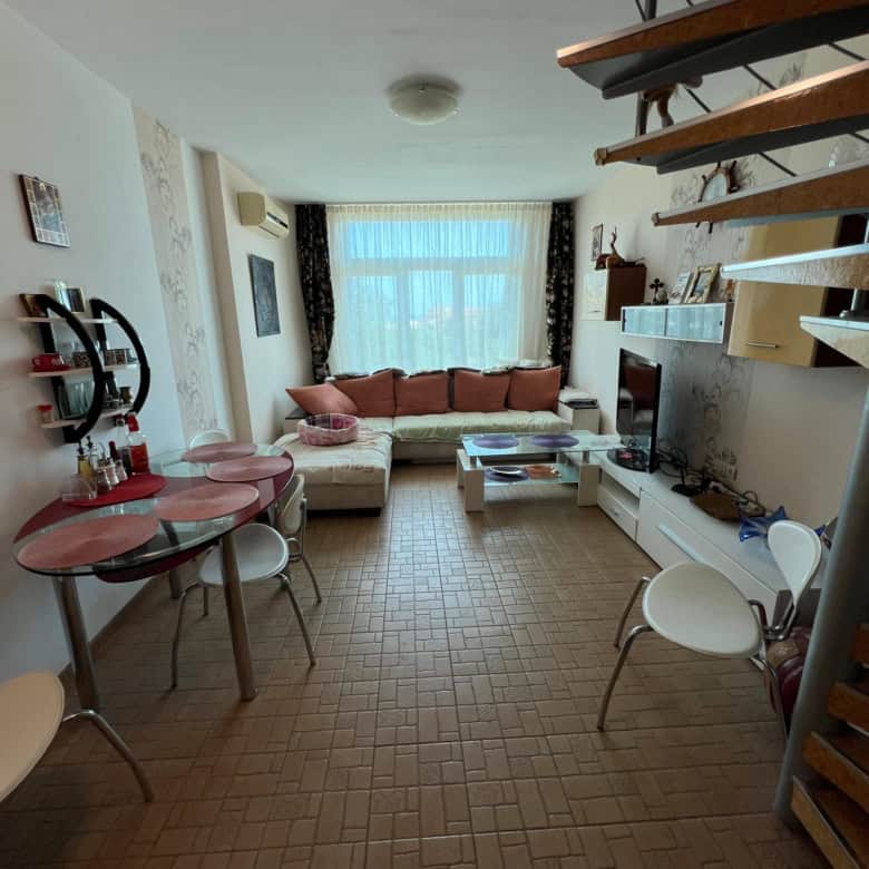 Bright interior of a one-bedroom maisonette with partial sea view in Sunny Beach. Modern furnishings.