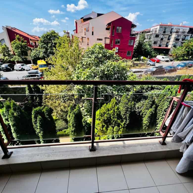 Balcony view of Sveti Vlas with colorful buildings and lush greenery.
