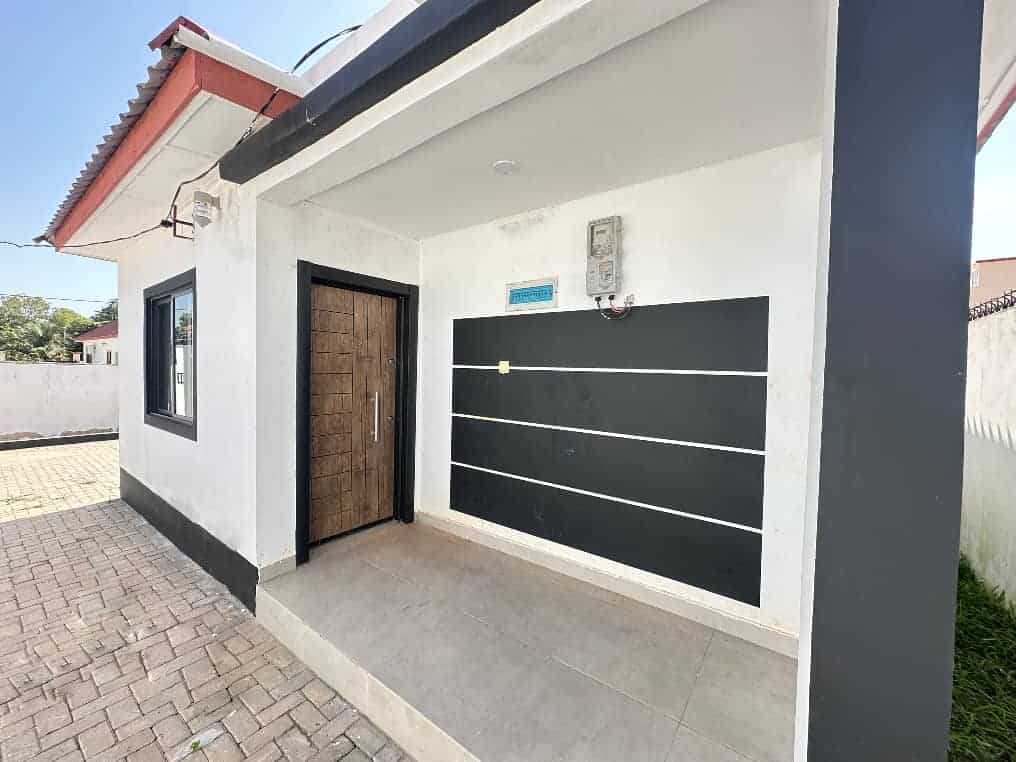 Modern villa entrance in Brufut Gardens Estate, Gambia. Contemporary villa entrance with black and white exterior in Brufut Gardens, Gambia.
