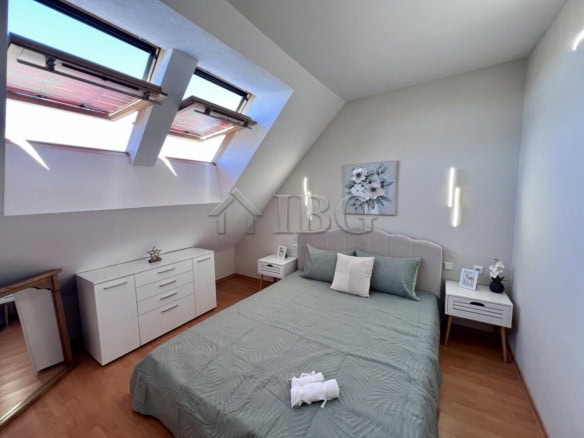 Comfortable bedroom with pool view in Dolce Vita 2, Sveti Vlas. Bright, modern interior with skyligh.