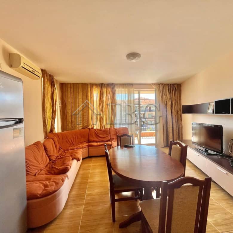 Bright living room with large windows and balcony view in Sveti Vlas.