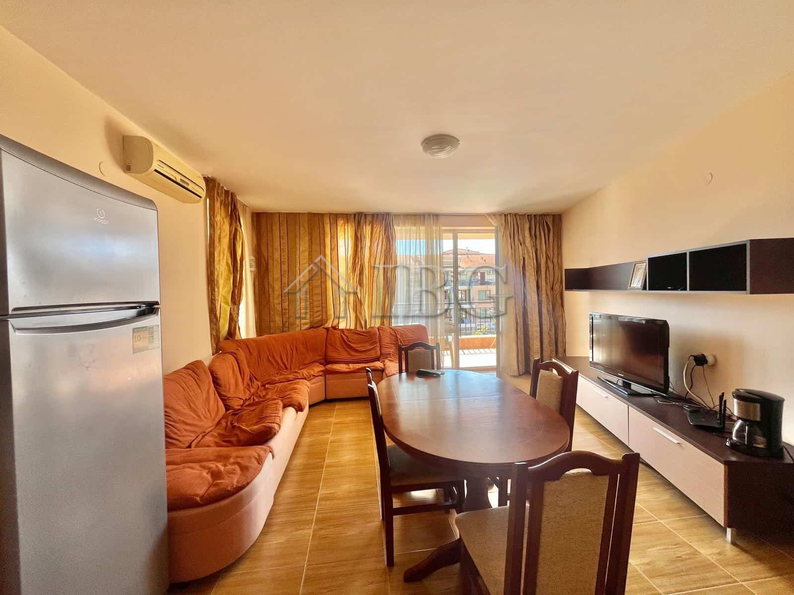 Bright living room with large windows and balcony view in Sveti Vlas.