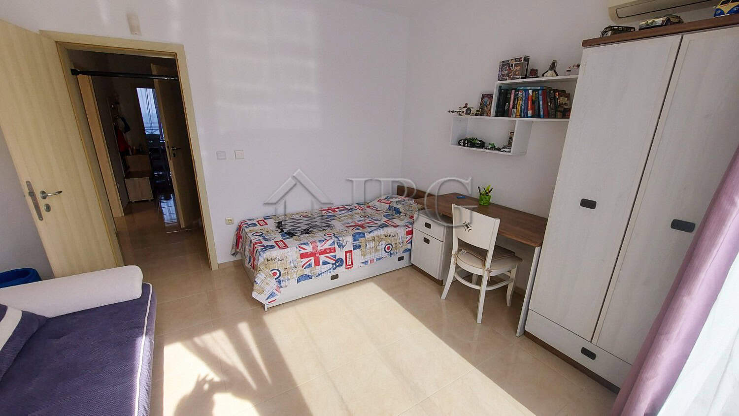 Bright 2-bedroom apartment with sea view, modern furniture, and natural light in Pomorie.