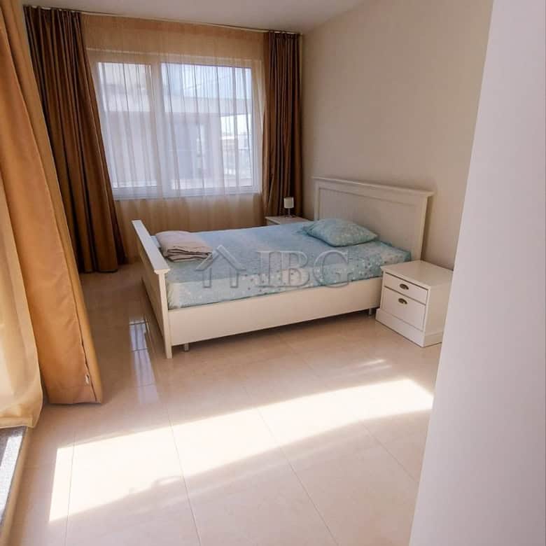 Bright bedroom with sea view in Pomorie apartment.