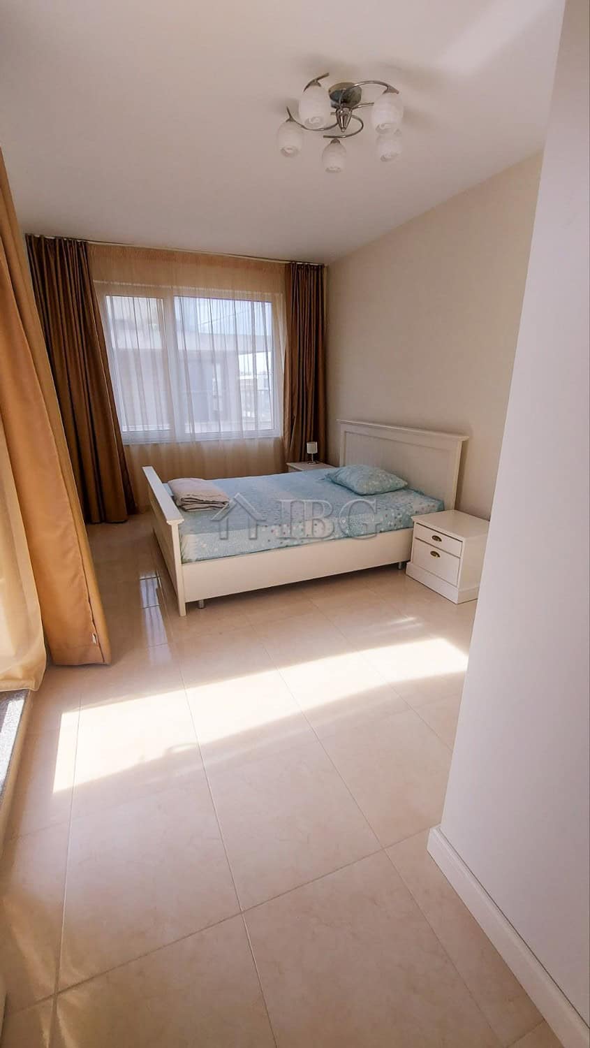 Bright bedroom with sea view in Pomorie apartment.