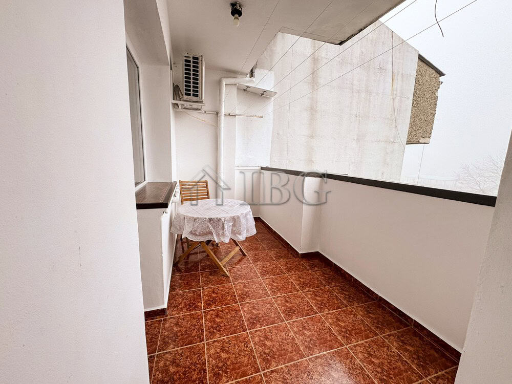 Balcony of a 2-bedroom apartment in Druzhba 2, Ruse, with outdoor seating and city views.