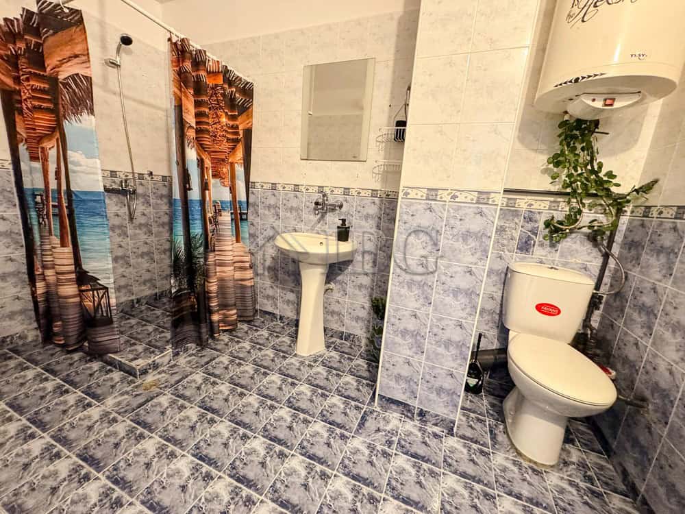 Bright bathroom with shower, sink, and toilet in Druzhba 2, Ruse.