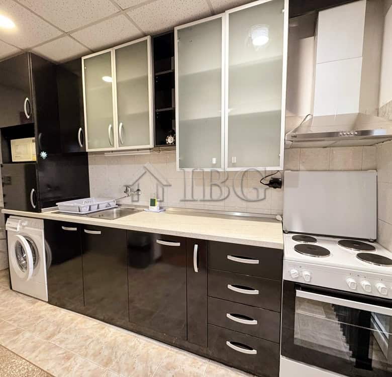 Spacious kitchen with black and white cabinets in Druzhba 2, Ruse, ideal for comfortable living.