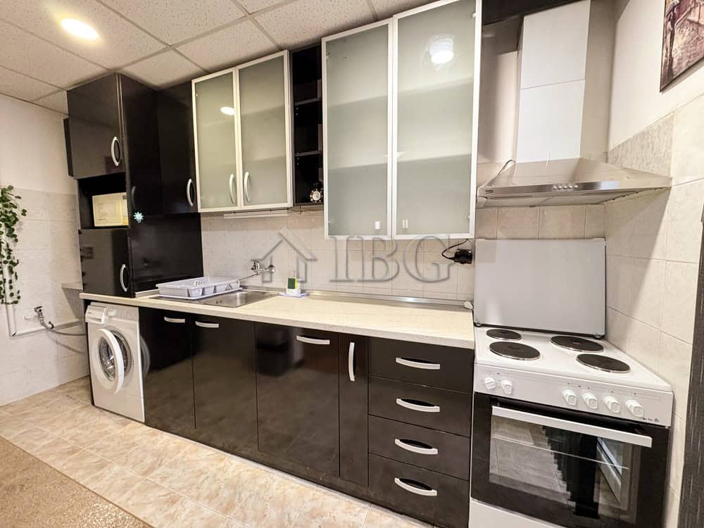 Spacious kitchen with black and white cabinets in Druzhba 2, Ruse, ideal for comfortable living.