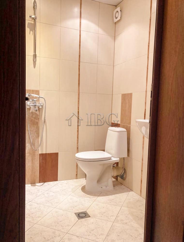 Cozy Two-Bedroom Apartment Near Ruse Center Clean bathroom with toilet and shower in Ruse apartment rental.