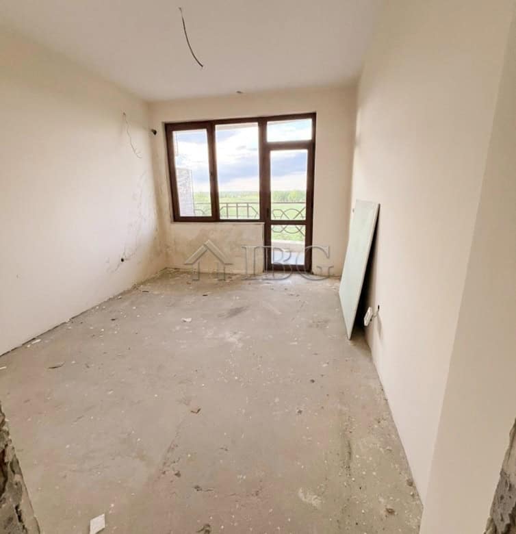 Apartment interior with large window overlooking golf course in Balchik.