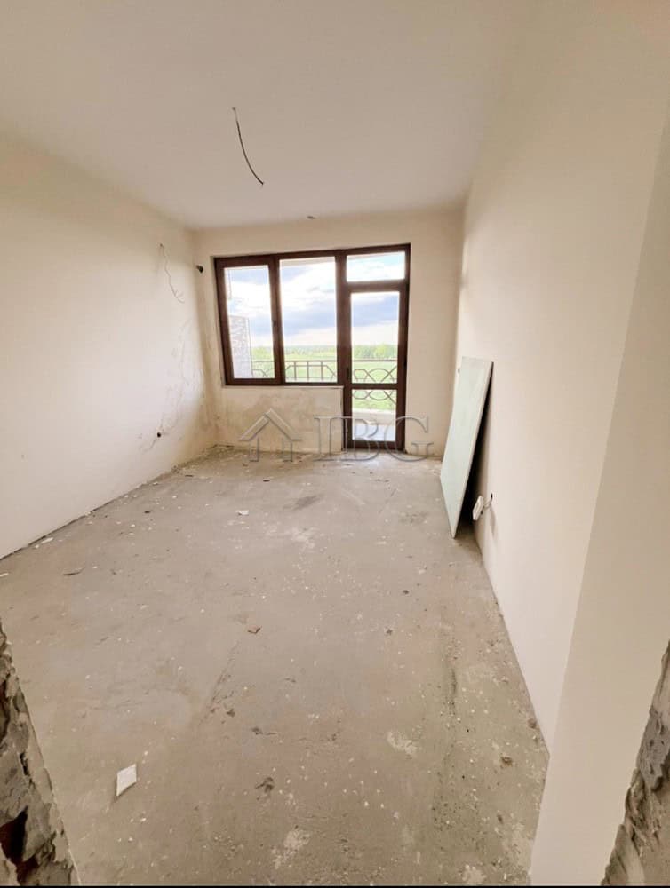 Apartment interior with large window overlooking golf course in Balchik.