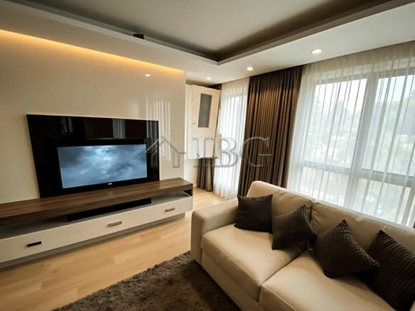 Spacious living room with large windows and contemporary decor near Svoboda Square.