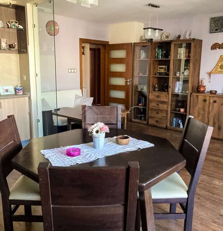 Apartment interior with dining table and living area near the city center.