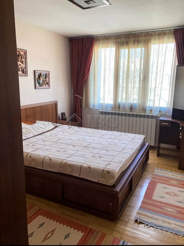 Cozy Two-Bedroom Apartment Near Ruse Center Spacious bedroom with large window, natural light, and comfortable furnishings. Ideal for rent near.