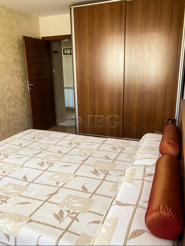 Two-Bedroom Apartment Interior Spacious bedroom with large wardrobe and cozy bed near the top center of Ruse.