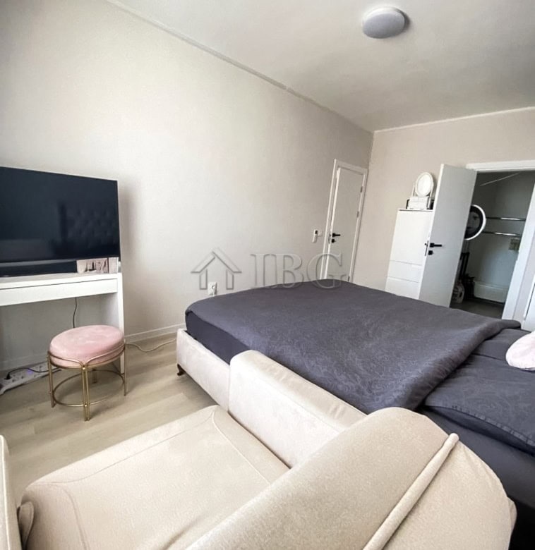 Spacious 2-bedroom apartment with contemporary decor, comfortable seating, and a view of the pool at.