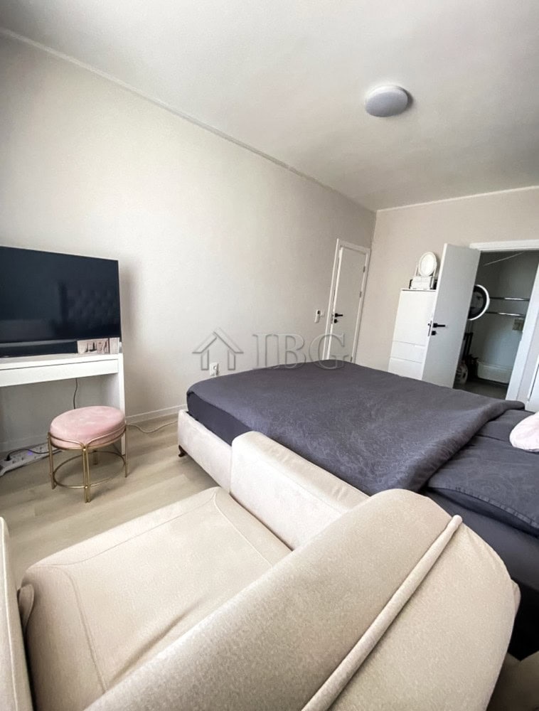 Spacious 2-bedroom apartment with contemporary decor, comfortable seating, and a view of the pool at.