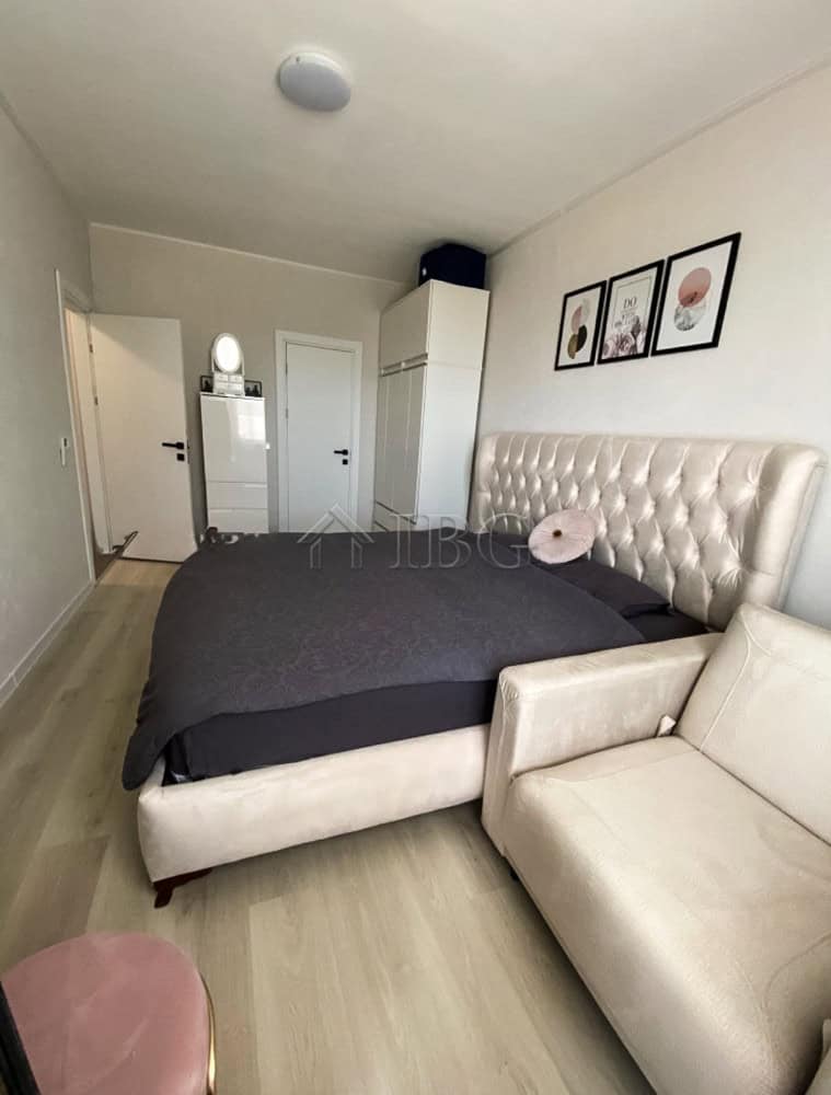 Modern 2-bedroom apartment with pool view at Lighthouse Golf & Spa Resort, featuring stylish decor a.